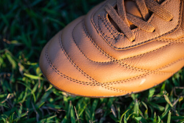 A kangaroo leather football shoe in vintage brown colorway with classic style stitching pattern....