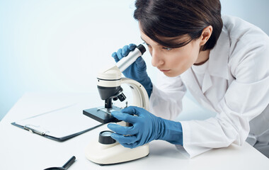 female doctor research biology ecology experiment analysis light background