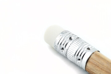 Macro photo of the back side of a pencil with an eraser on it, isolated on a white background.