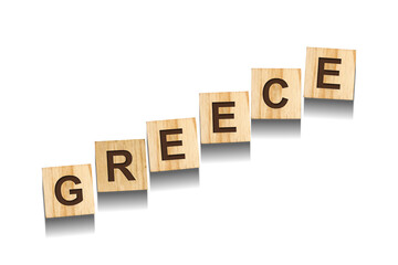 Greece, word on wooden blocks. Isolated on a white background.
