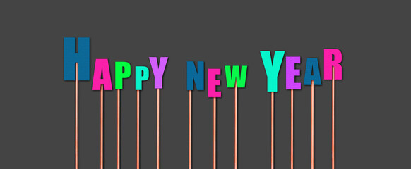 Happy New Year Inscription from letters on sticks, isolated on dark gray background. New Year. Christmas holiday.