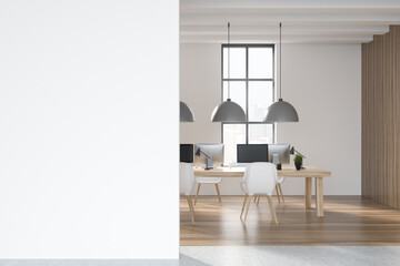 Light business room interior with table and pc, window with city view. Mockup