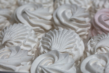 Homemade marshmallow in a gift box. Zephyr in the form of roses. Close-up shot.