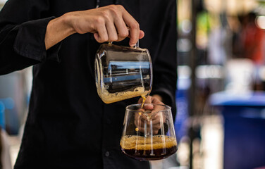 Barista making drip coffee by hand