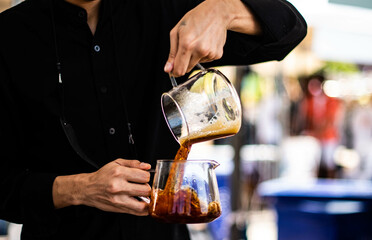 Barista making drip coffee by hand