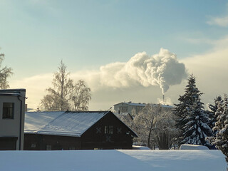 A large cloud of white smoke from the chimney.