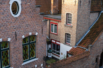 red facades of buildings in Bruges