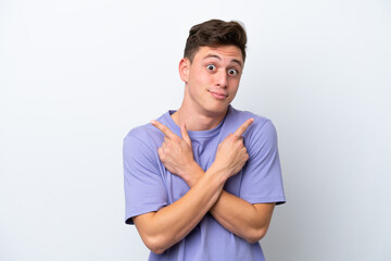 Obraz premium Young handsome Brazilian man isolated on white background pointing to the laterals having doubts