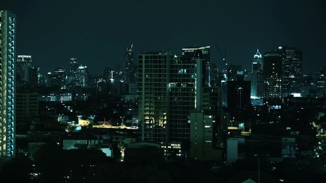 Bangkok, Thailand - Sep 9, 2021 : Aerial landscape of colorful city at night. Great night landscape, Aerial panorama of Embarcadero and Financial District skyscrapers and buildings.