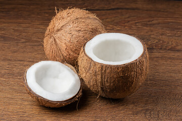 Coconut with half on dark background