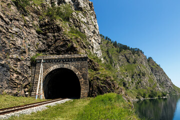 Fototapeta na wymiar Circum-Baikal Railway. Old railroad tunnel number 36 on the railway. tunnel Khabartuy 3