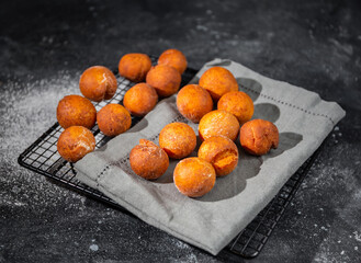 curd balls on a napkin on a dark background 