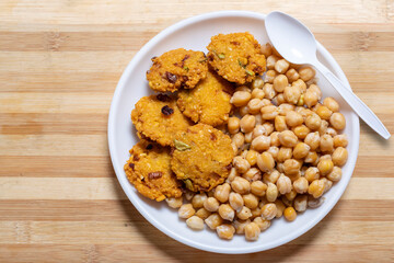 Tea time snack, a vegetarian snack Chickpea Sundal and Masala Vada (Lentil Wada).