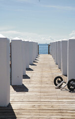 view of a Walkway from wooden boards along the ocean shore in Pompano Beach in Florida, USA