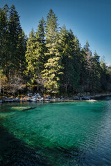 Eibsee - beautiful blue green lake in the mountains with forest in the background