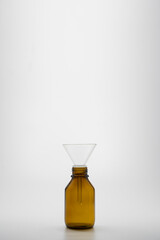 A dark brown medicine bottle