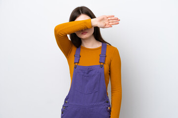 Young Russian woman isolated on blue background covering eyes by hands