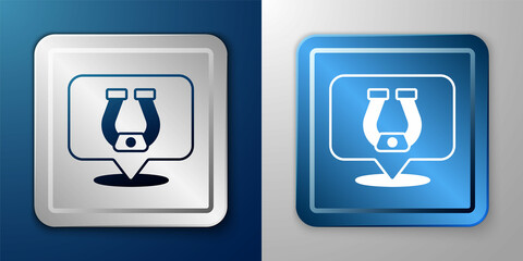 White Horseshoe icon isolated on blue and grey background. Silver and blue square button. Vector