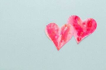Cut the heart shaped paper, put on a pastel background.