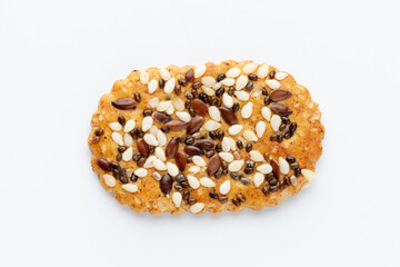 Tasty crackers with seeds on the white background.