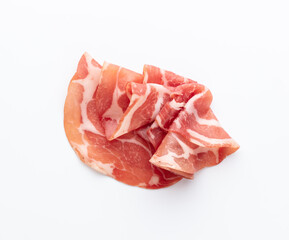 Italian prosciutto crudo or jamon. Raw ham. Isolated on white background.