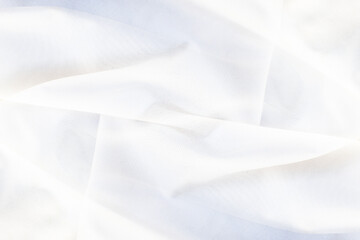 Abstract white background of folded silk fabric