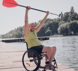 Person with a physical disability who uses wheelchair will be ride on sup board