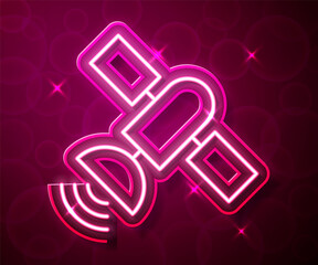 Glowing neon line Satellite icon isolated on red background. Vector