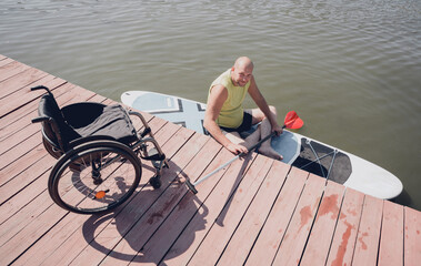 Person with a physical disability ride on sup board