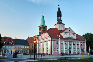 The market square with the town hall and the church bell tower .