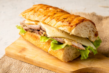 Homemade pork cubanos sandwich close-up. Classic fast food.