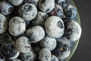 frozen ripe blueberries closeup background