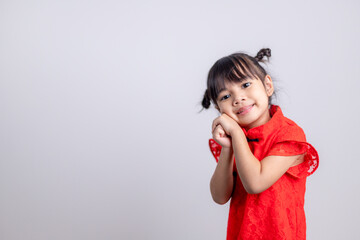 happy Chinese new year. Little Asian girls with Congratulation gesture