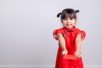 happy Chinese new year. smiling Asian little girls holding red envelope