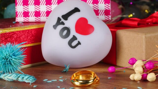 Heart Shape of I love You and Wedding Ring on Bokeh Background