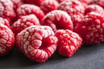 frozen red raspberries background closeup