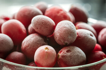 frozen red cranberries background closeup