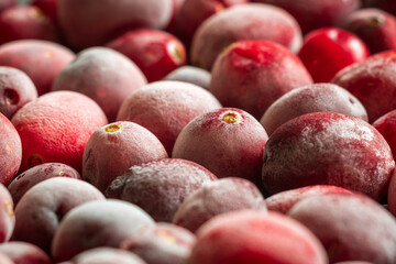 frozen red cranberries background closeup