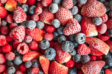 frozen mix strawberries blueberries raspberries and cranberries closeup