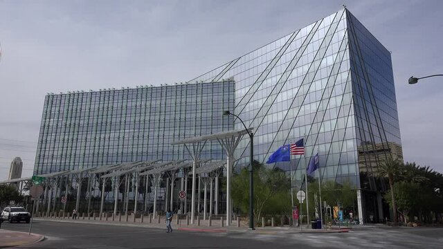 Las Vegas City Hall & road traffic with a police car opposite the building. Nevada, USA.
