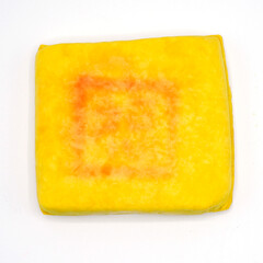 Yellow tufu on white background. It's an asian style healthty ingredient food.