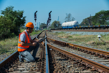 person on railway. engineer sitting on railway inspection. construction worker on railways. Engineer work on railway.rail,engineer,Infrastructure