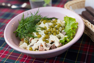 traditional with peas and mayonnaise in a pink bowl