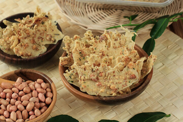 Rempeyek Kacang or Peyek Kacang is Traditional Snack from Java, Indonesia. Rempeyek is Fried Fritter  Made from Rice Flour and Water with Peanuts on Top. Usually Served Accompanied Nasi Pecel