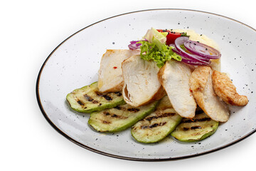 Baked chicken fillet on a pillow of mashed potatoes. Isolated on a white background.