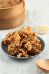 Crispy Fried Oyster Mushroom or Jamur Krispi. Oyster Mushroom Coated with Spiced Flour and Depp Fried. Usually Served with Tomato Sauce
