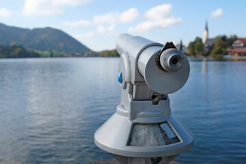 Telescope at the waterfront of lake Schliersee in Bavaria, Germany