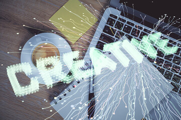 Start up theme drawing over computer on the desktop background. Top view. Double exposure. Brainstorm concept.