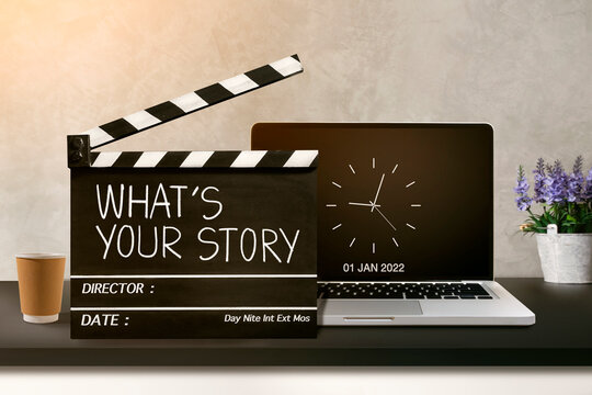 What's your story. Handwriting on film slate.storytelling, inspiration , Screenwriting, and Filmmaking in the new year 2022.