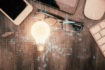 Double exposure of bulb drawing over table with phone. Top view. Concept of idea.